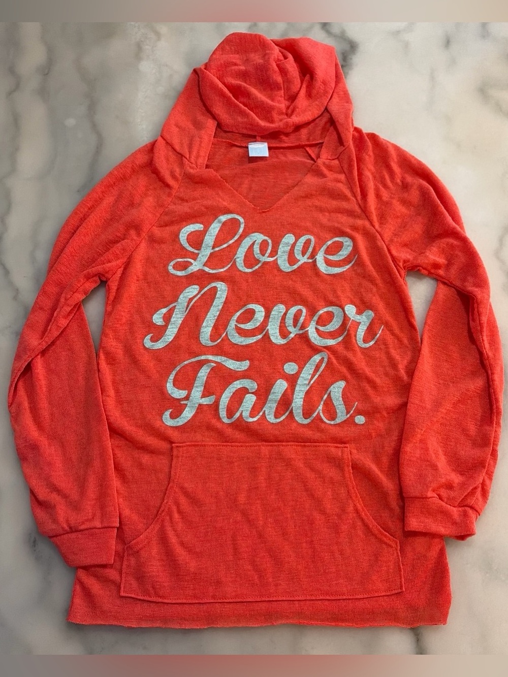 Orange Women's Hooded Sweatshirt with "Love Never Fails" Script
